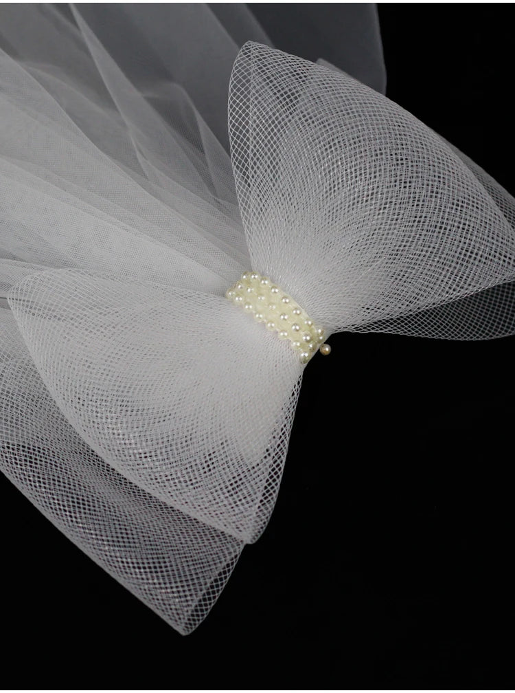 V302 White Bridal Veil with a bow Pearls Bows Multi-Layer Semi-Transparent Tulle Shoulder Length Brides Veil with Hair Comb