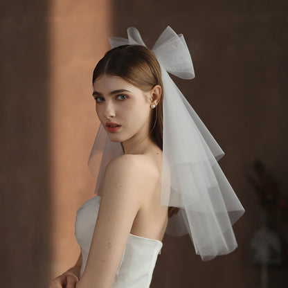 V302 White Bridal Veil with a bow Pearls Bows Multi-Layer Semi-Transparent Tulle Shoulder Length Brides Veil with Hair Comb