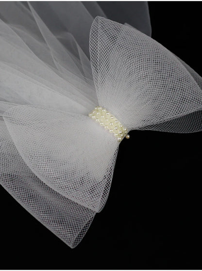 V302 White Bridal Veil with a bow Pearls Bows Multi-Layer Semi-Transparent Tulle Shoulder Length Brides Veil with Hair Comb