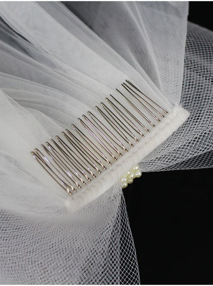 V302 White Bridal Veil with a bow Pearls Bows Multi-Layer Semi-Transparent Tulle Shoulder Length Brides Veil with Hair Comb