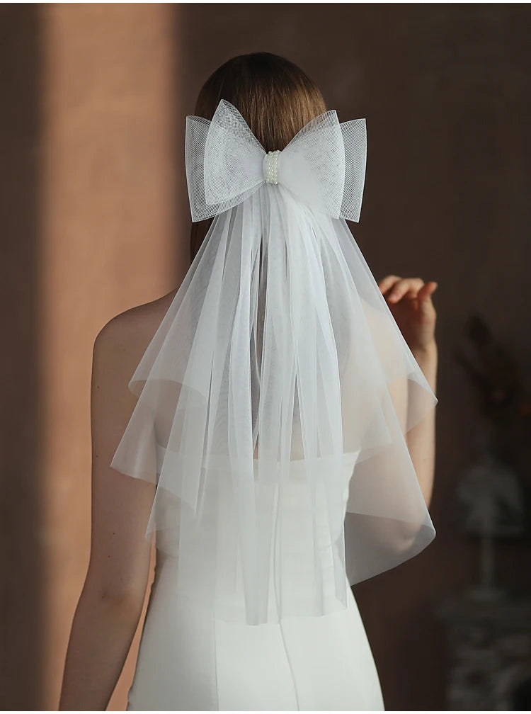 V302 White Bridal Veil with a bow Pearls Bows Multi-Layer Semi-Transparent Tulle Shoulder Length Brides Veil with Hair Comb