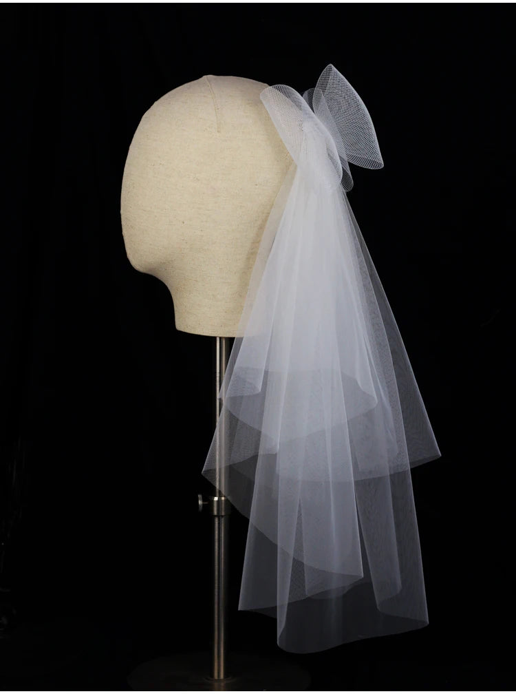 V302 White Bridal Veil with a bow Pearls Bows Multi-Layer Semi-Transparent Tulle Shoulder Length Brides Veil with Hair Comb